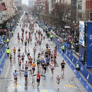 Boston Marathon runners make their way down Boylston Street.