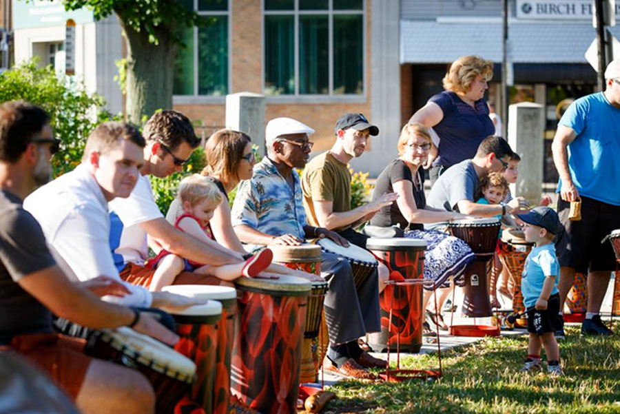Image for cornell coley (center) led a drum circle at adams park in roslindale