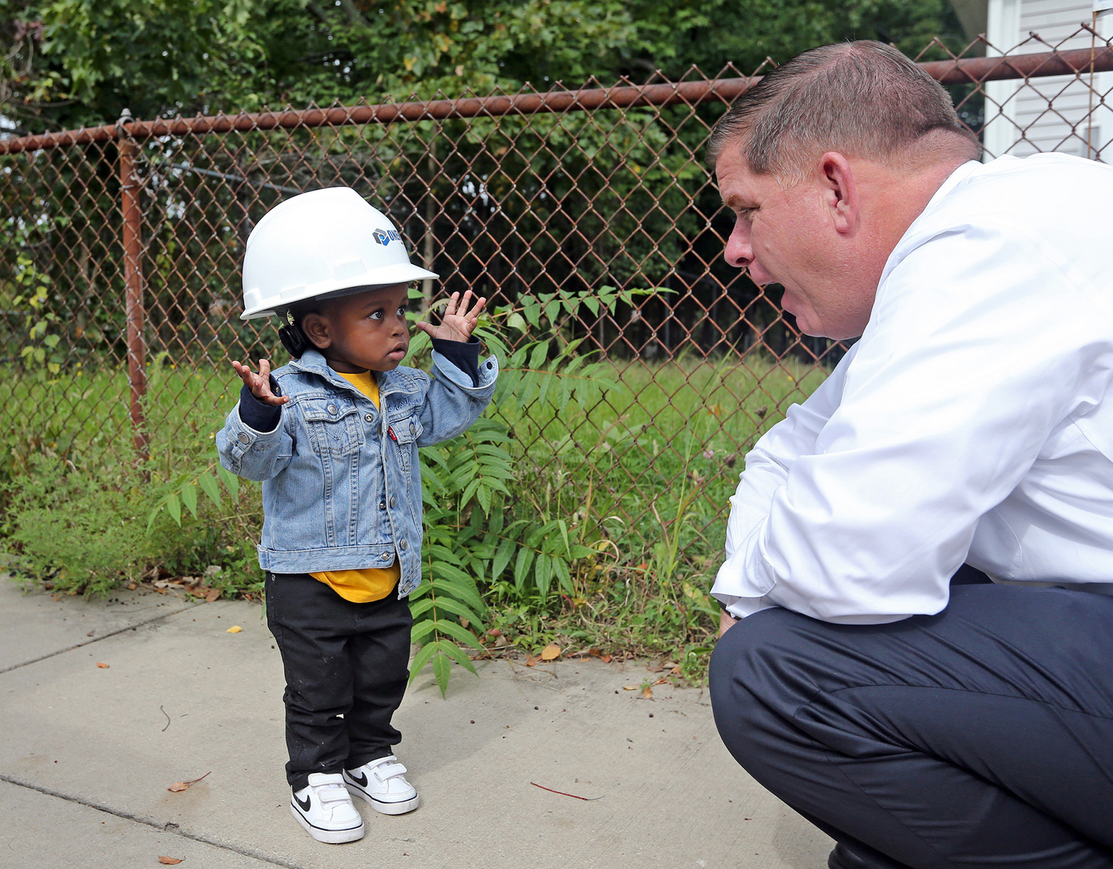 Image for mayor walsh with a young boston resident 