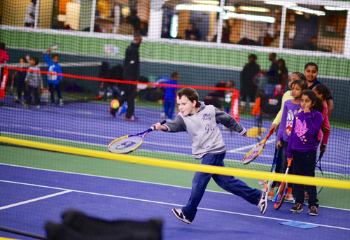 Image for volley against violence kid playing tennis