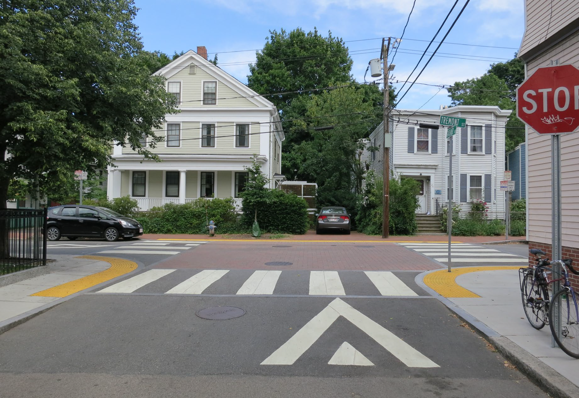 At the point where a street intersects with another, the pavement is raised to the same level as the sidewalks.