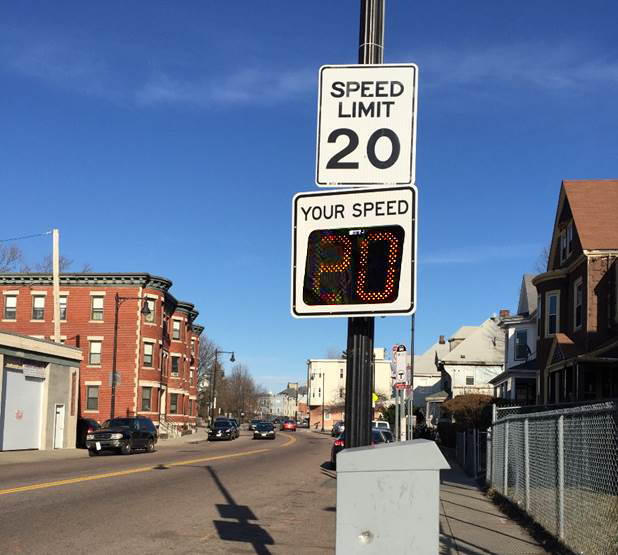 Underneath a 25 MPH speed limit sign, a digital sign displays "your speed".