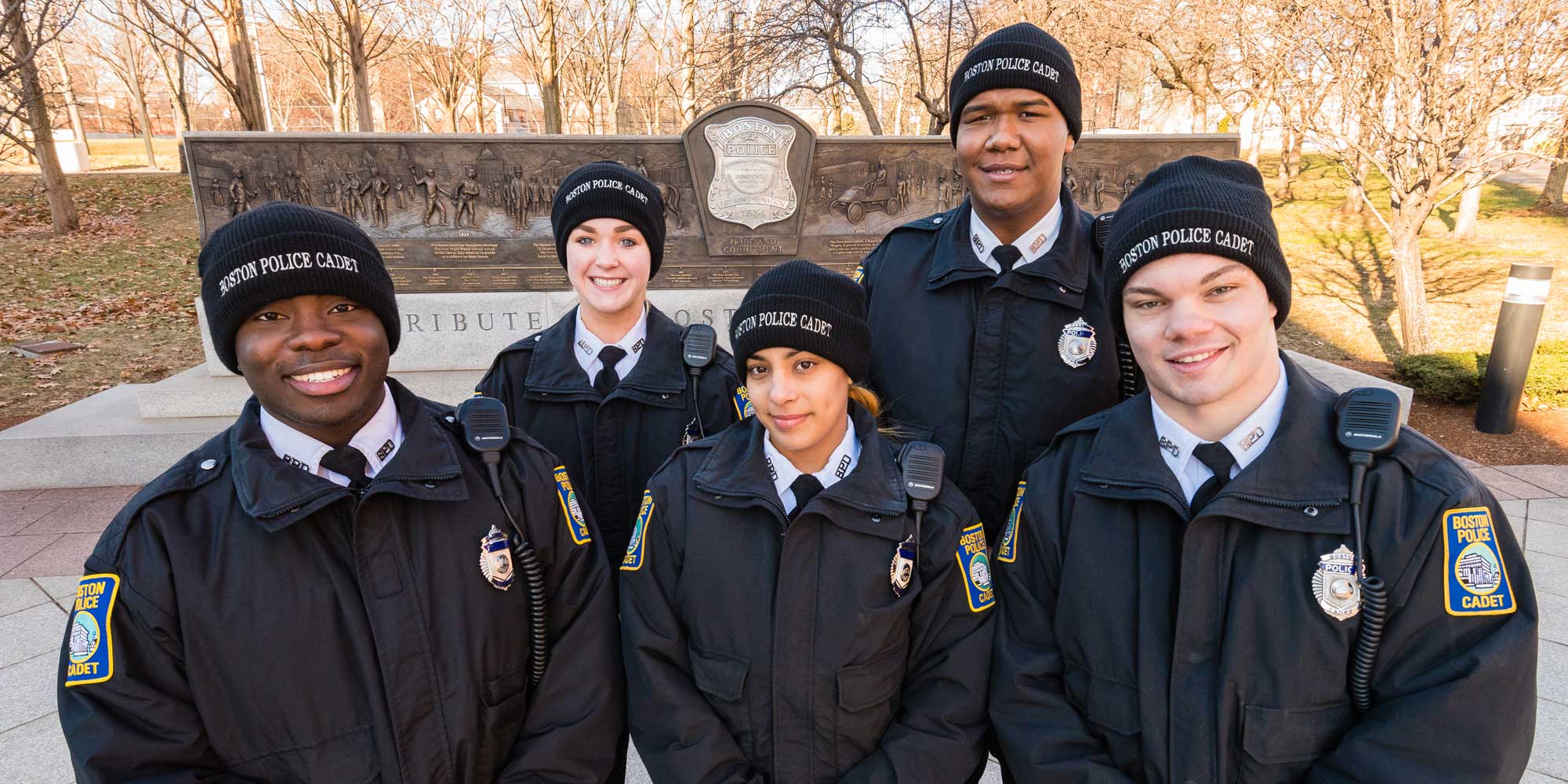 A group of smiling police cadets