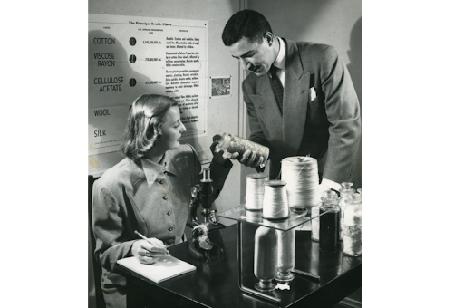Unidentified student and instructor in a textile technology class with samples of textile fibers at the Prince School of Retailing, 1949, Courtesy of Simmons University Archives.