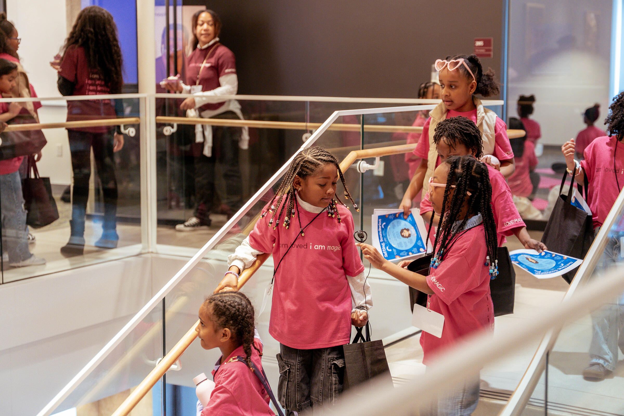 group of young black girls walking down stairs