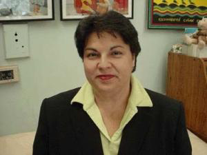 an image of a woman, margarita muniz, smiling