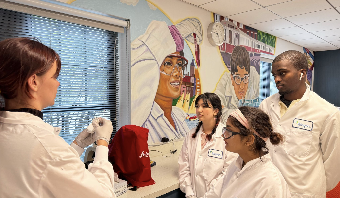 Group of youth in white lab coats