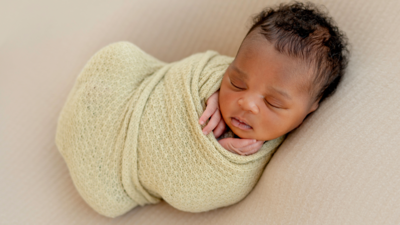 baby swaddled sleeping on back