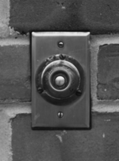 a black and white image of a doorbell