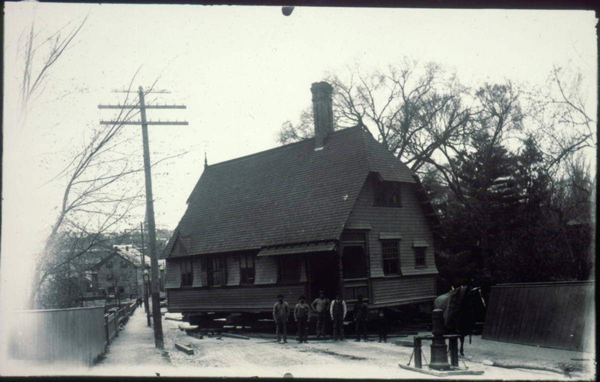 Moving a house with horse and capson, location unknown, circa 1890-1920
