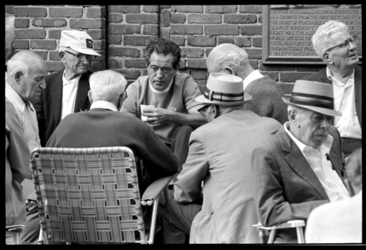Close-up of men playing cards on Paul Revere Mall ca. August 1972, Jeff Albertson photo collection, Special Collections and University Archives, University of Massachusetts Amherst Libraries