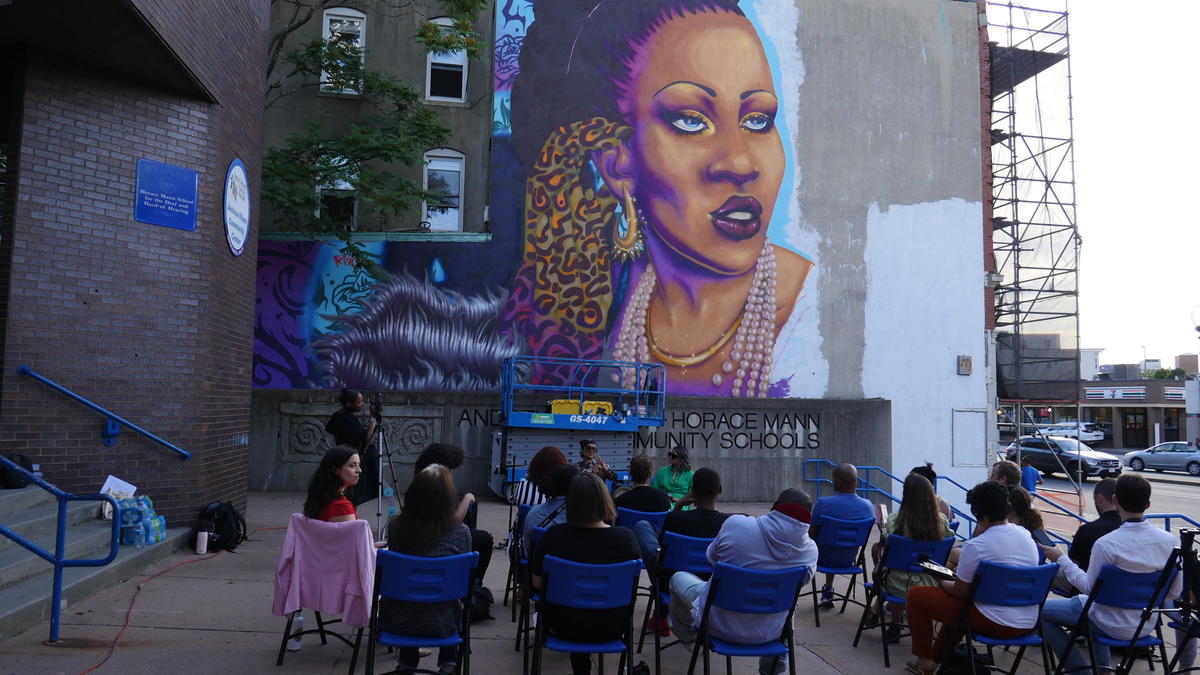 Artist talk in front of 'Rita's Spotlight' mural in Allston