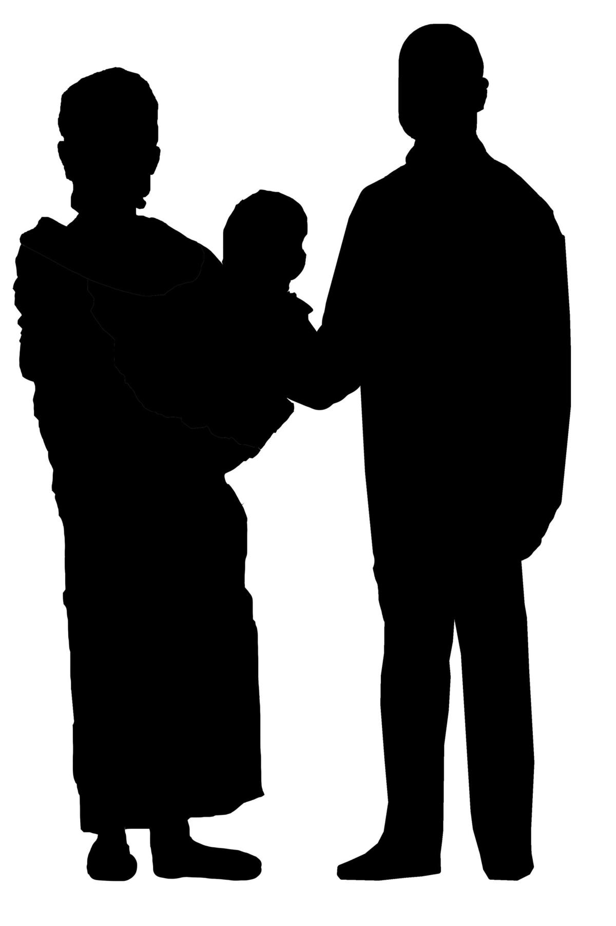 A silhouette of a man and a woman. The woman is holding their baby in her arms.