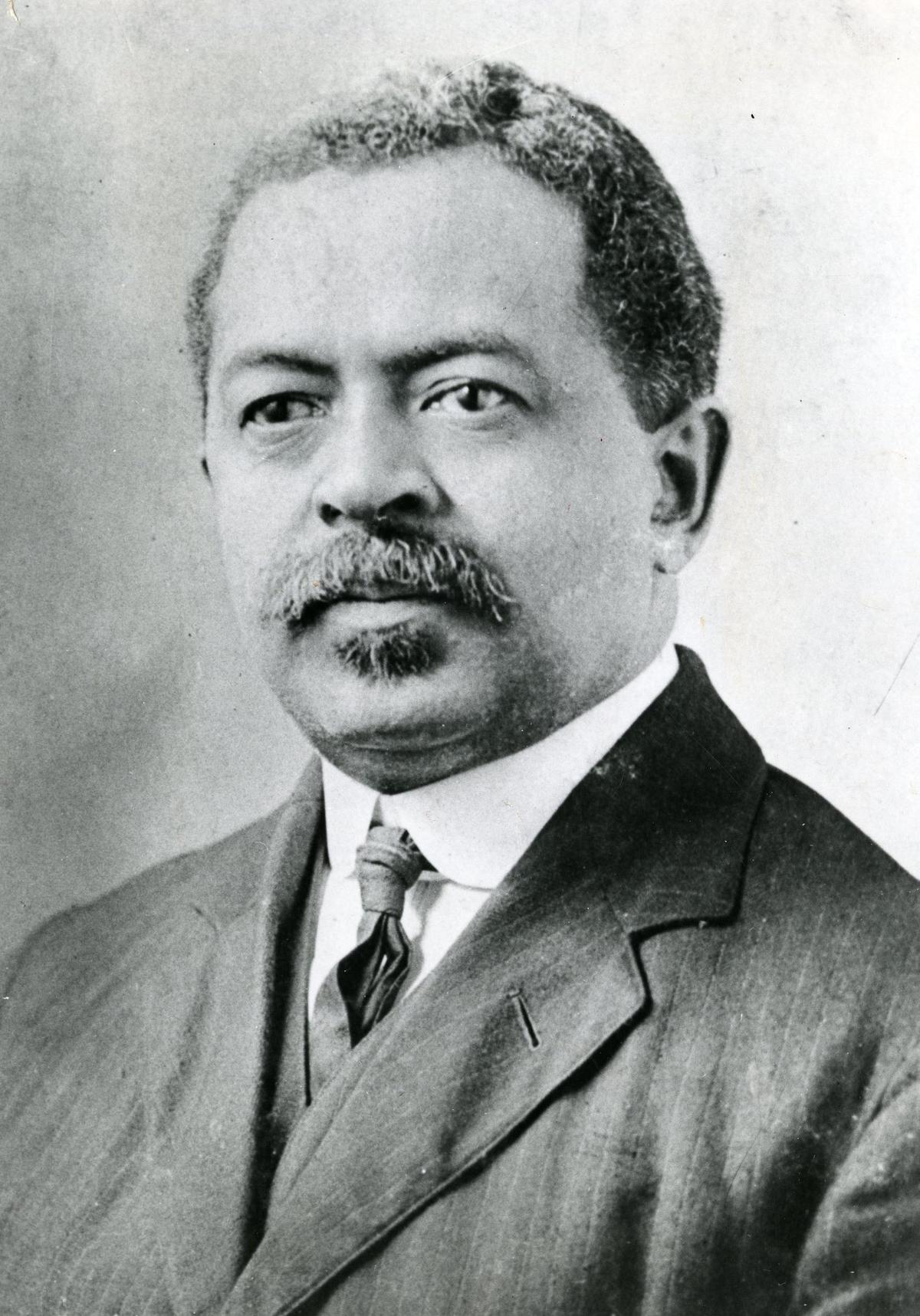 A c.1920 photographic portrait of William Monroe Trotter in a 3-piece suit and tie.