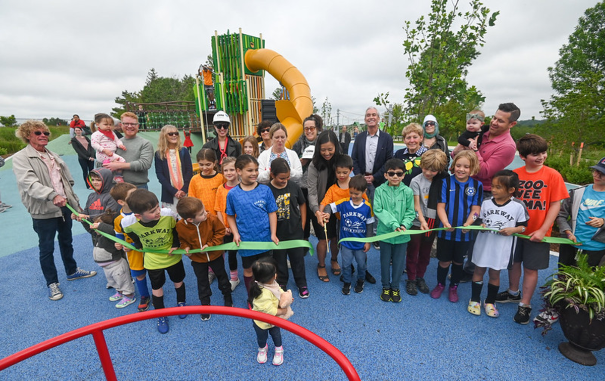 Mayor Michelle Wu joins local children and members of the Menino and Hennessy families to cut the ribbon on the new Alice Hennessy Playground at Millennium Park in West Roxbury.