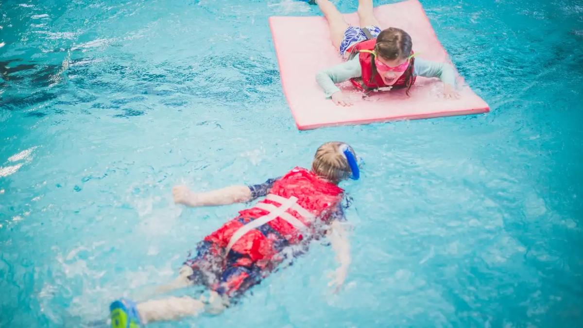 Kids swimming in a pool