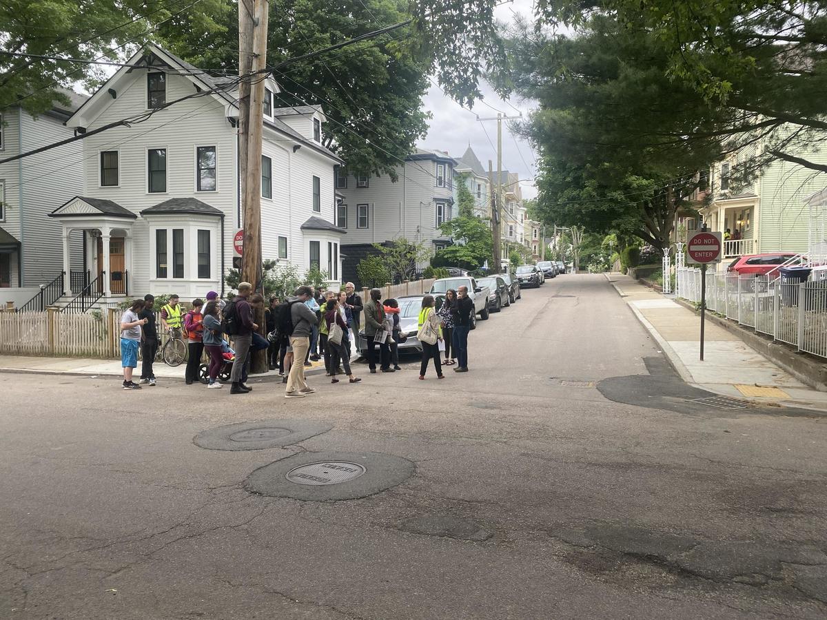 Neighbors walk with a BTD planner along Boylston Street in Jamaica Plain.