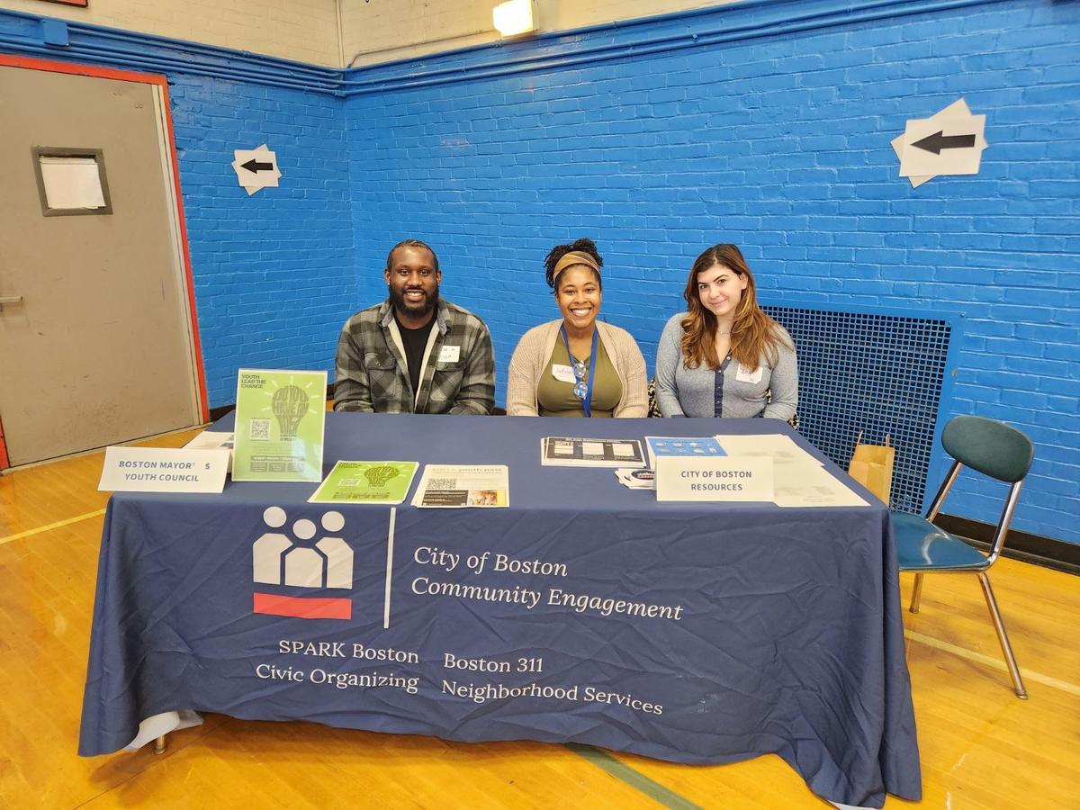 311 staff members tabling at Excel High School 