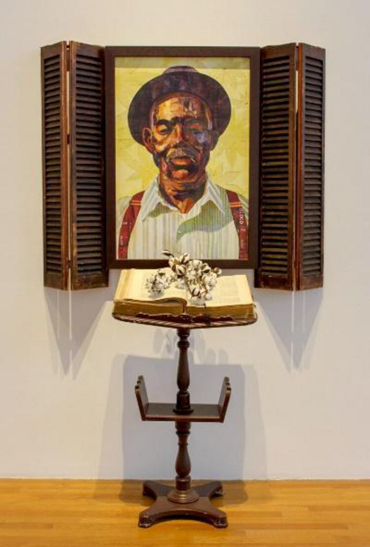 A painting of a painting of old farmer with a book in front of the painting on a pulpit and flowers on top of the book