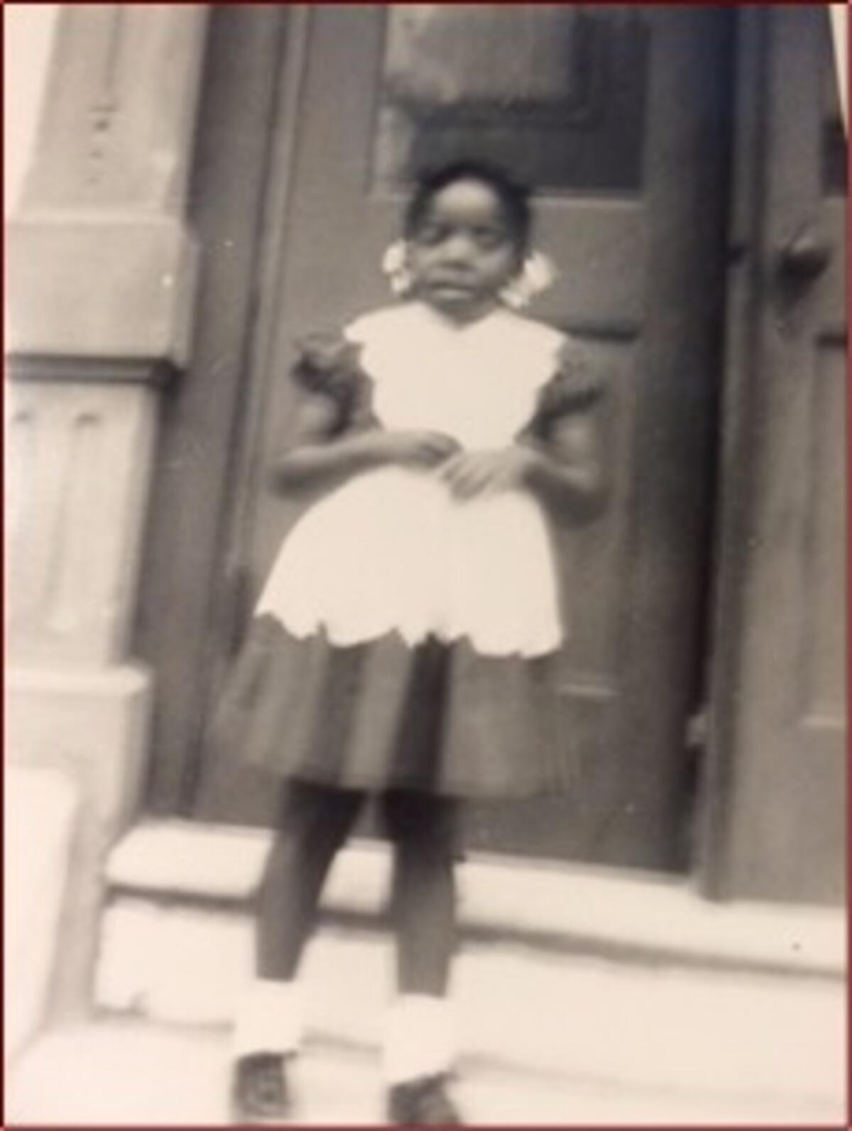 a picture of Jeri Robinson as a young girl in a dress