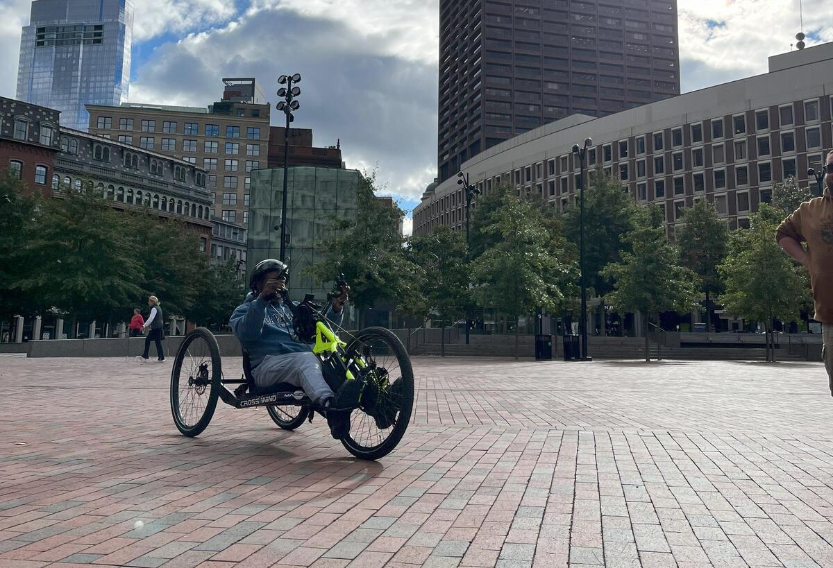 a person with disability trying an e-handcycle