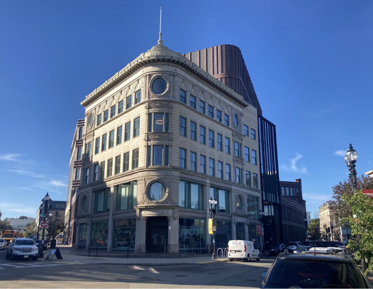 Image of the Bruce C. Bolling Building with the restored historic Ferdinand’s Blue Store facade facing the intersection of Washington and Warren streets. 