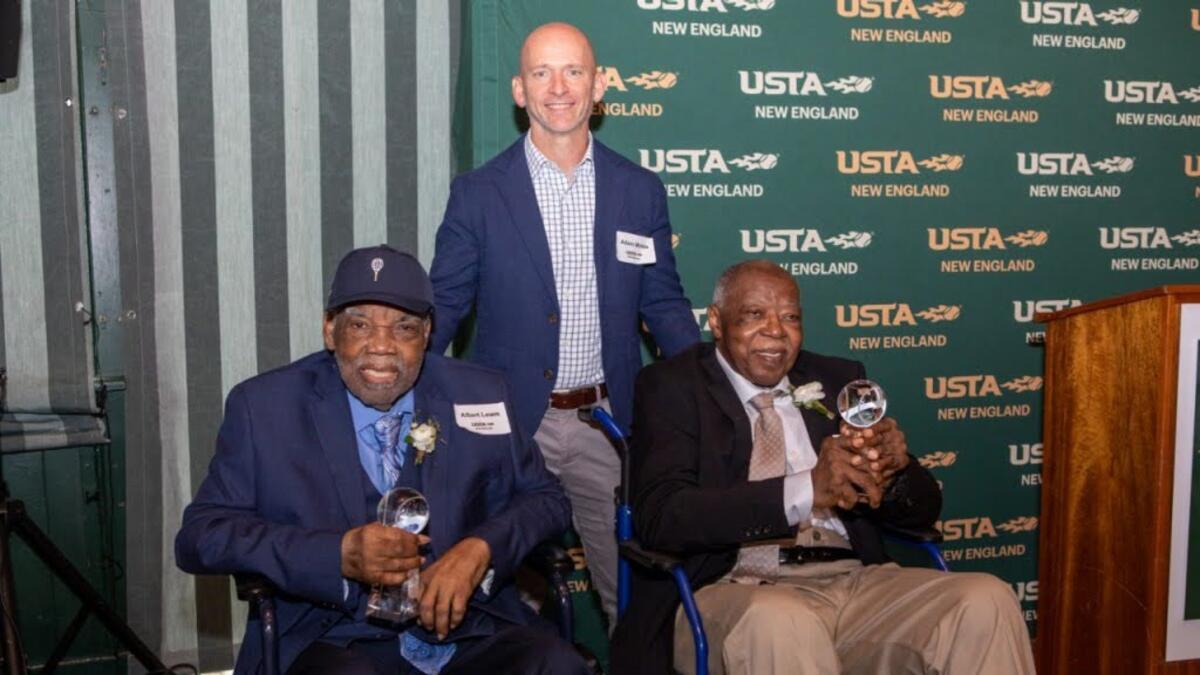 Albert "Bootsie" Lewis and his co-founder of their tennis club pose for a photo as they are inducted into the USTA New England Hall of Fame