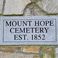 Sign on the gatepost of Mount Hope Cemetery