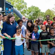 Mayor Wu cut the ribbon at the official reopening of Mission Hill Playground
