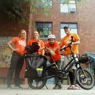 Boston Bikes Team pose with an e-cargo bike