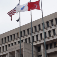 American flag and Turkish flag over City Hall Plaza in Boston