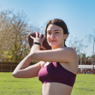 Girl throwing football