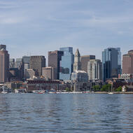Boston is seen across the water from LoPresti Park in East Boston on a clear, sunny day