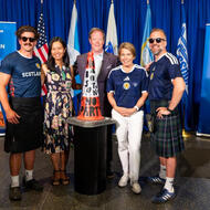 Danny Cambell, Mayor Michelle Wu, Massport CEO Richard Davey, Governor Maura Healey, and Andrew Dobbie pose for picture with Glasgow Traffic Cone