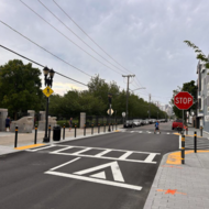 Street with crosswalk and pedestrian