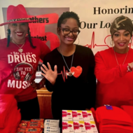 Three women holding up five fingers