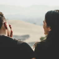 Man and woman talking from behind