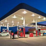 Gas station with one white car