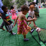 Image for children enjoyed the new artificial turf and lawn games on city hall plaza in 2015