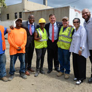 Image for  mayor walsh posed for a photo with community members and construction workers after the ceremonial ground breaking for new green space and parking in grove hall 
