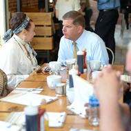 Image for mayor martin walsh speaks with business owners while touring the mission hill neighborhood of boston 