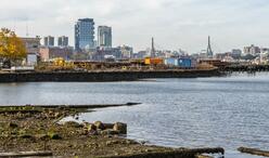 View from the Border Street waterfront, showing the existing coastline conditions, harbor, and skyline across the water.